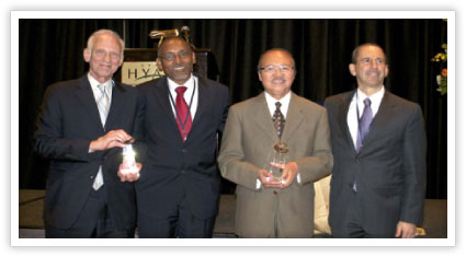 In photo from left, award recipient Dr. Edwin Silverman, ORR Director Eskinder Negash, award recipient Loc Nguyen, and Principal Deputy Assistant Secretary David Hansell.