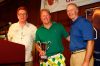 Individual Lowest Gross Score winner Rammy Rasmussen pictured with    Harold Greene and Monsignor Cox, Executive Director of Catholic    Charities.