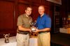 Men's Longest Drive winner Scot McMorris pictured with Monsignor    Cox, Executive Director of Catholic Charities.