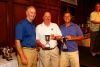 Putting contest winners Msgr. Joe Greeley and Phil Pecsok pictured    with Monsignor Cox, Executive Director of Catholic Charities.